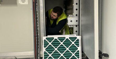 Photo showing a filter being changed in an Air Handling Unit.