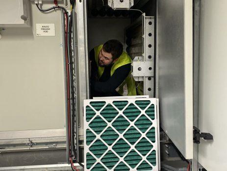 Photo showing a filter being changed in an Air Handling Unit.
